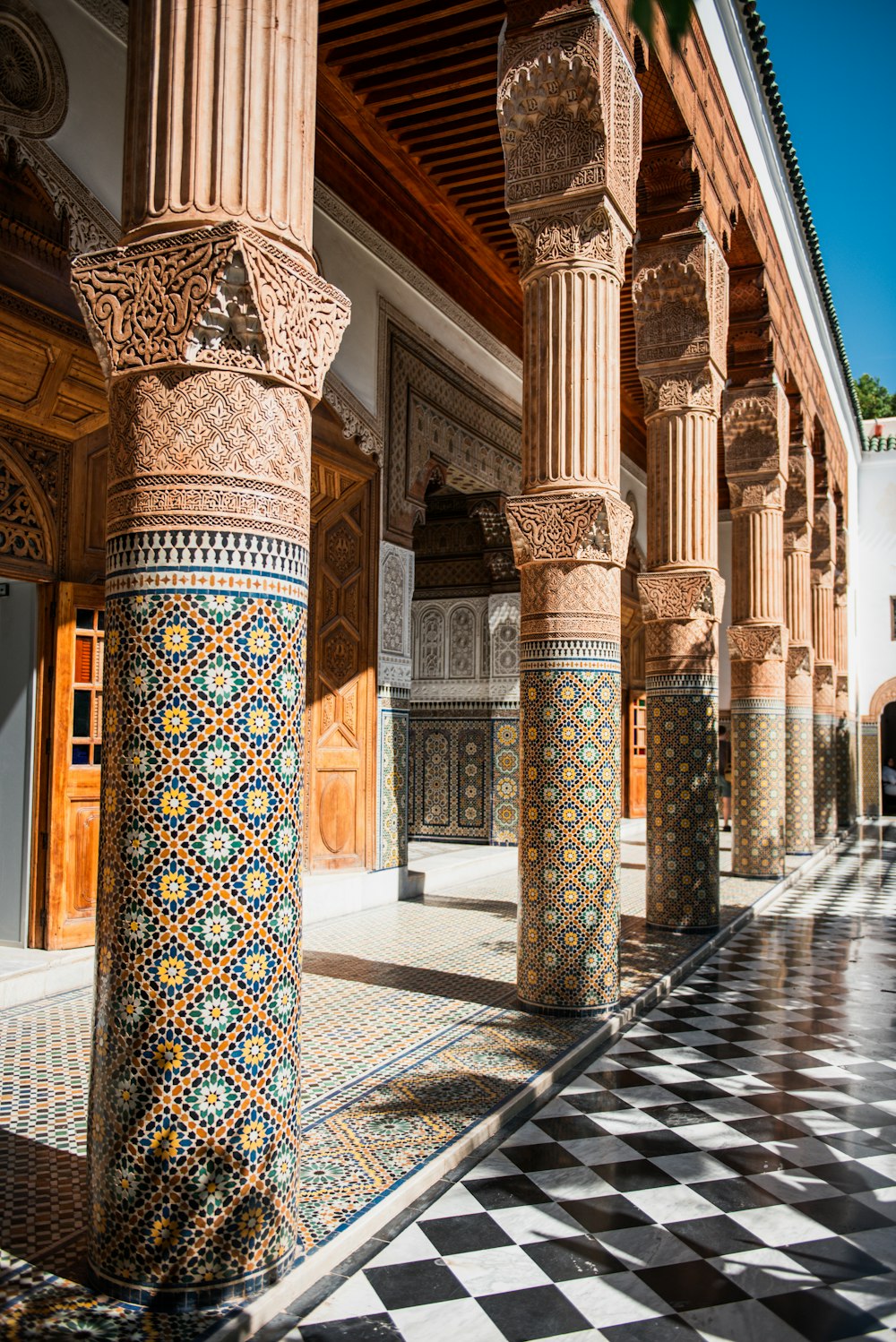 a building with a checkered floor and columns