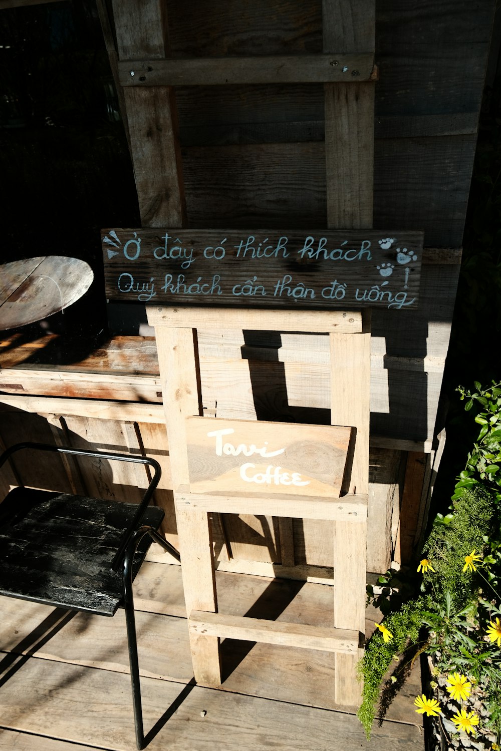 a wooden chair sitting on top of a wooden deck