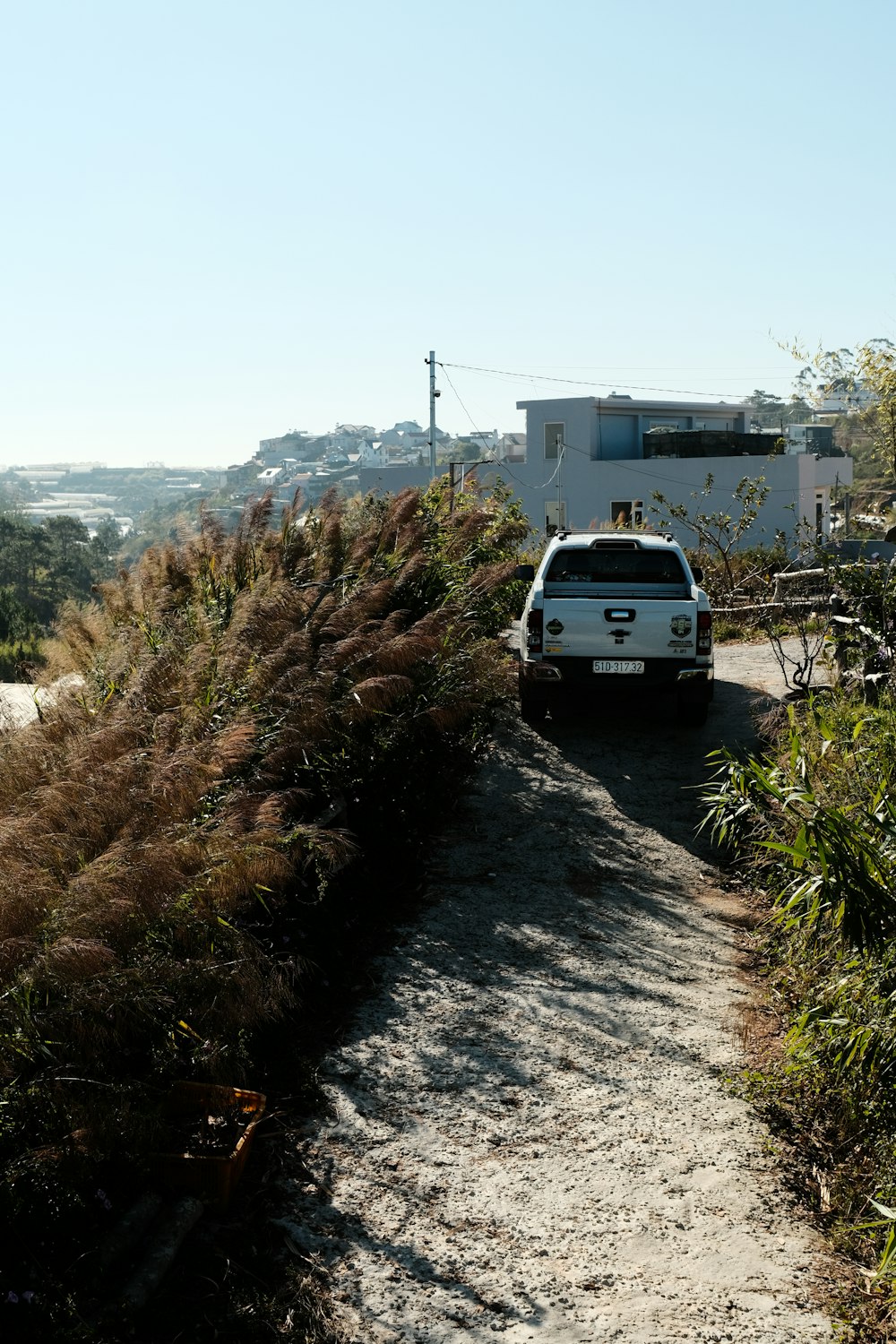 a van is parked on a dirt road