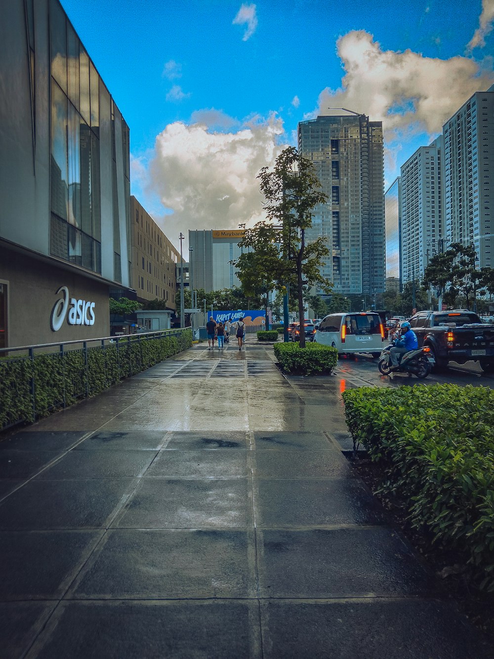 a city street with cars parked on the side of it