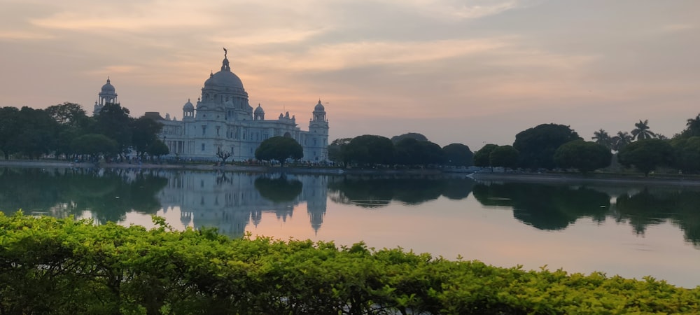 a large building sitting on top of a lake