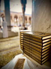 a stack of books sitting on top of a table