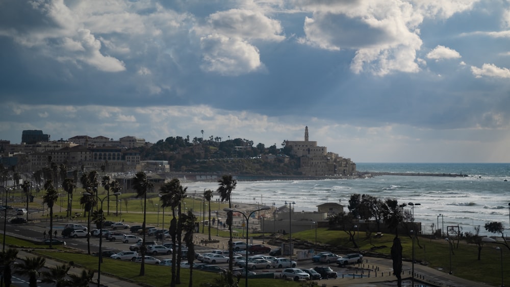 a view of a beach with cars parked on it