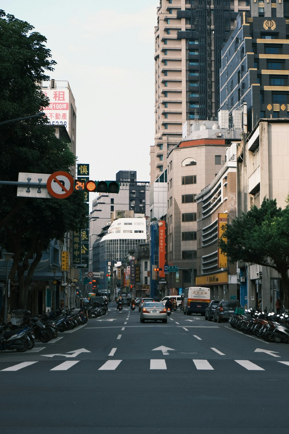 a city street filled with lots of tall buildings