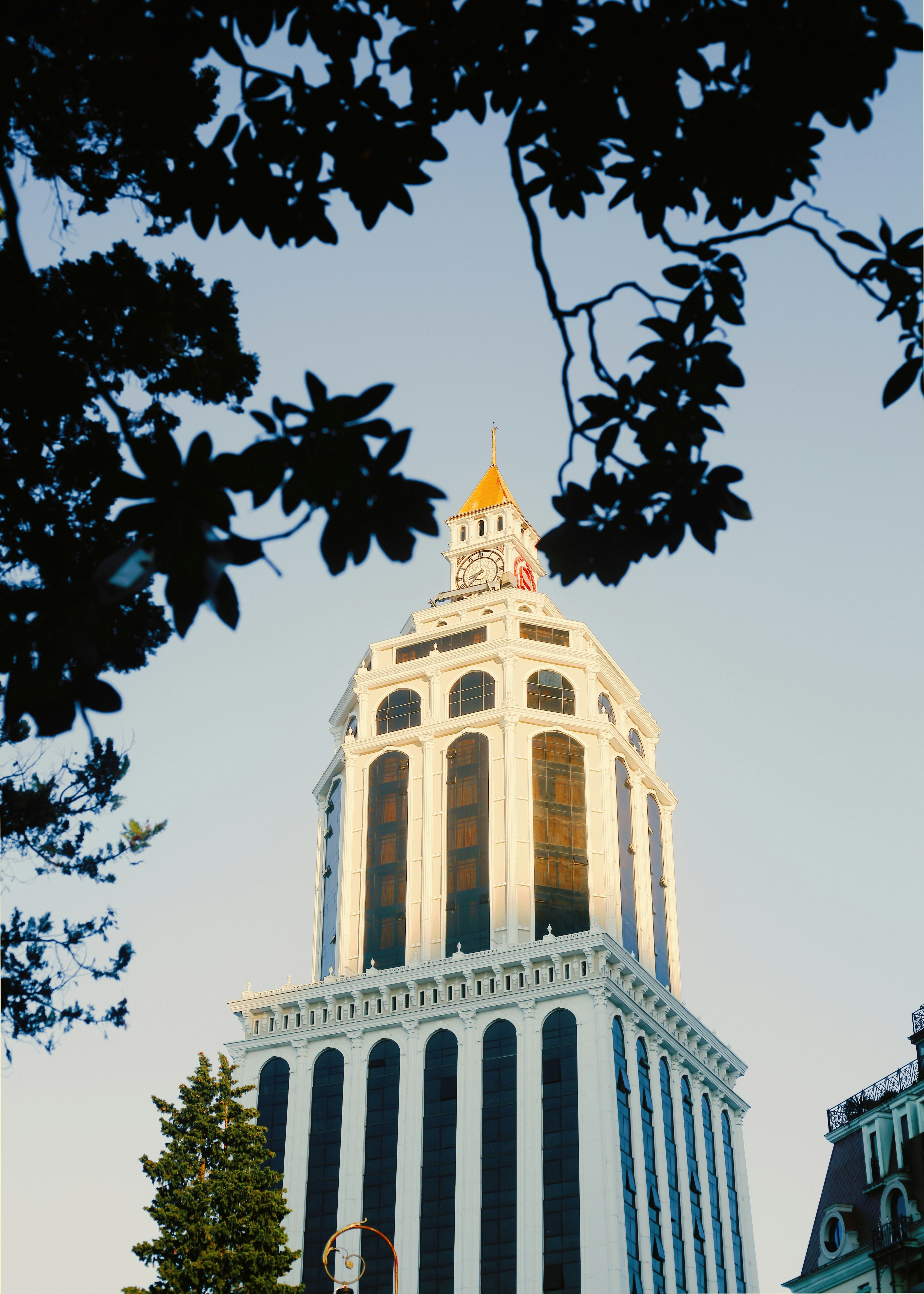 a tall building with a clock on the top of it