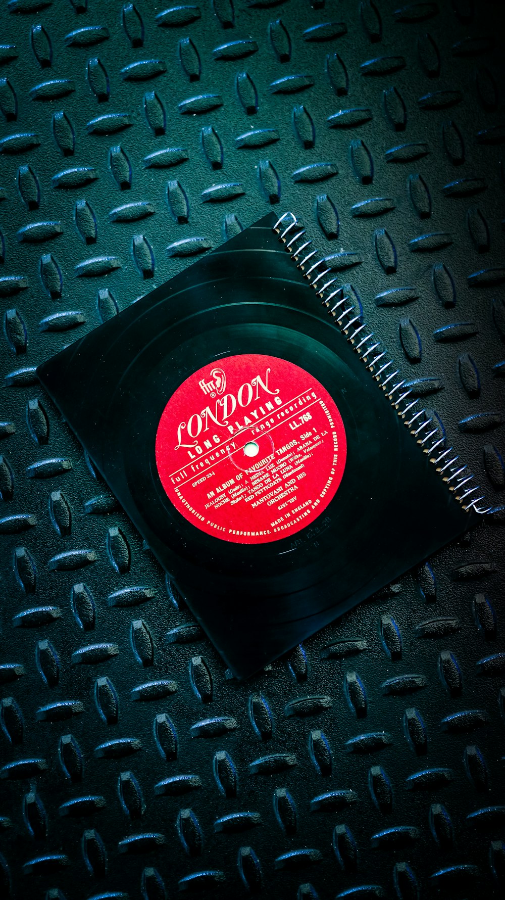 a record sitting on top of a metal table