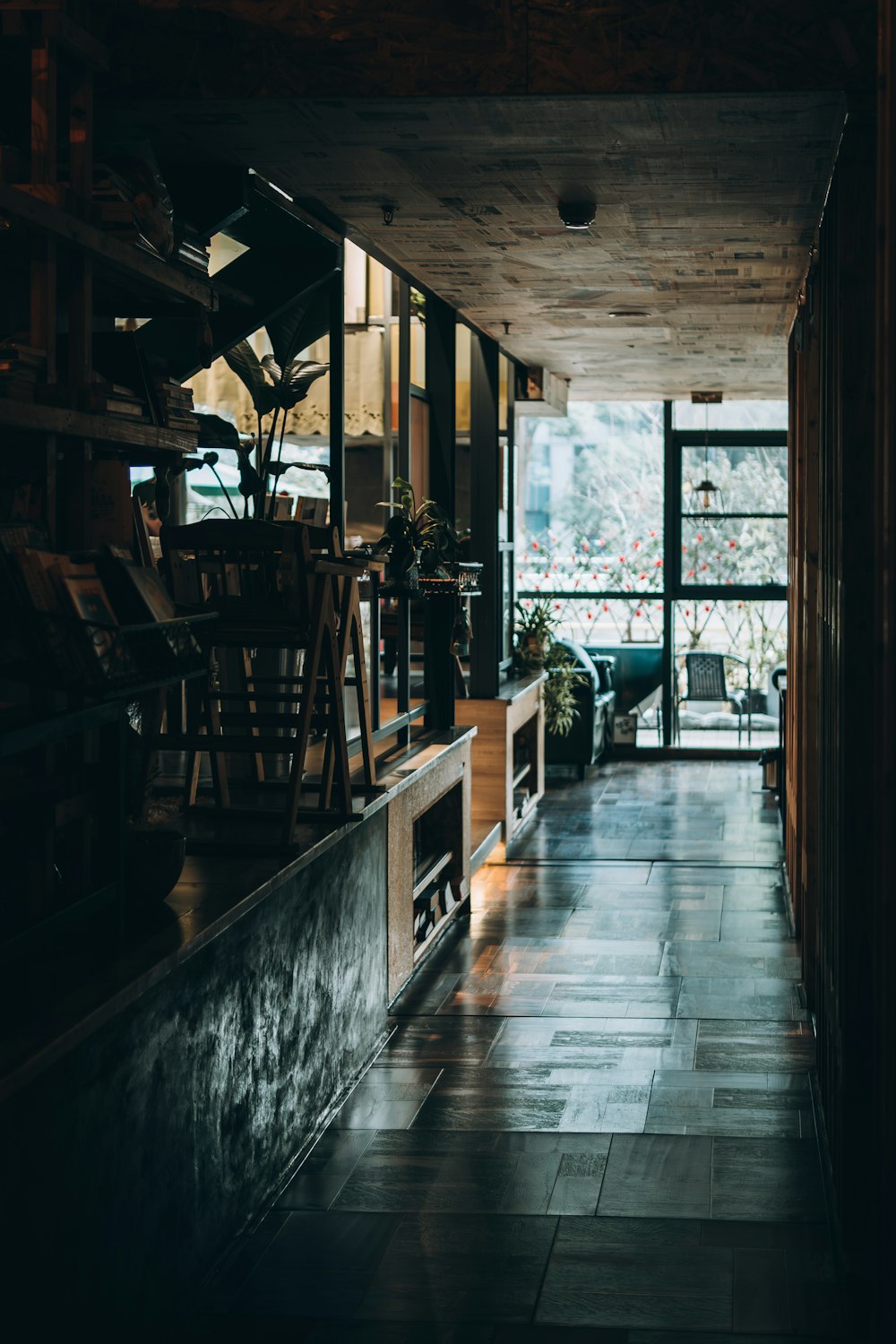 a long hallway with a fire place in the middle of it