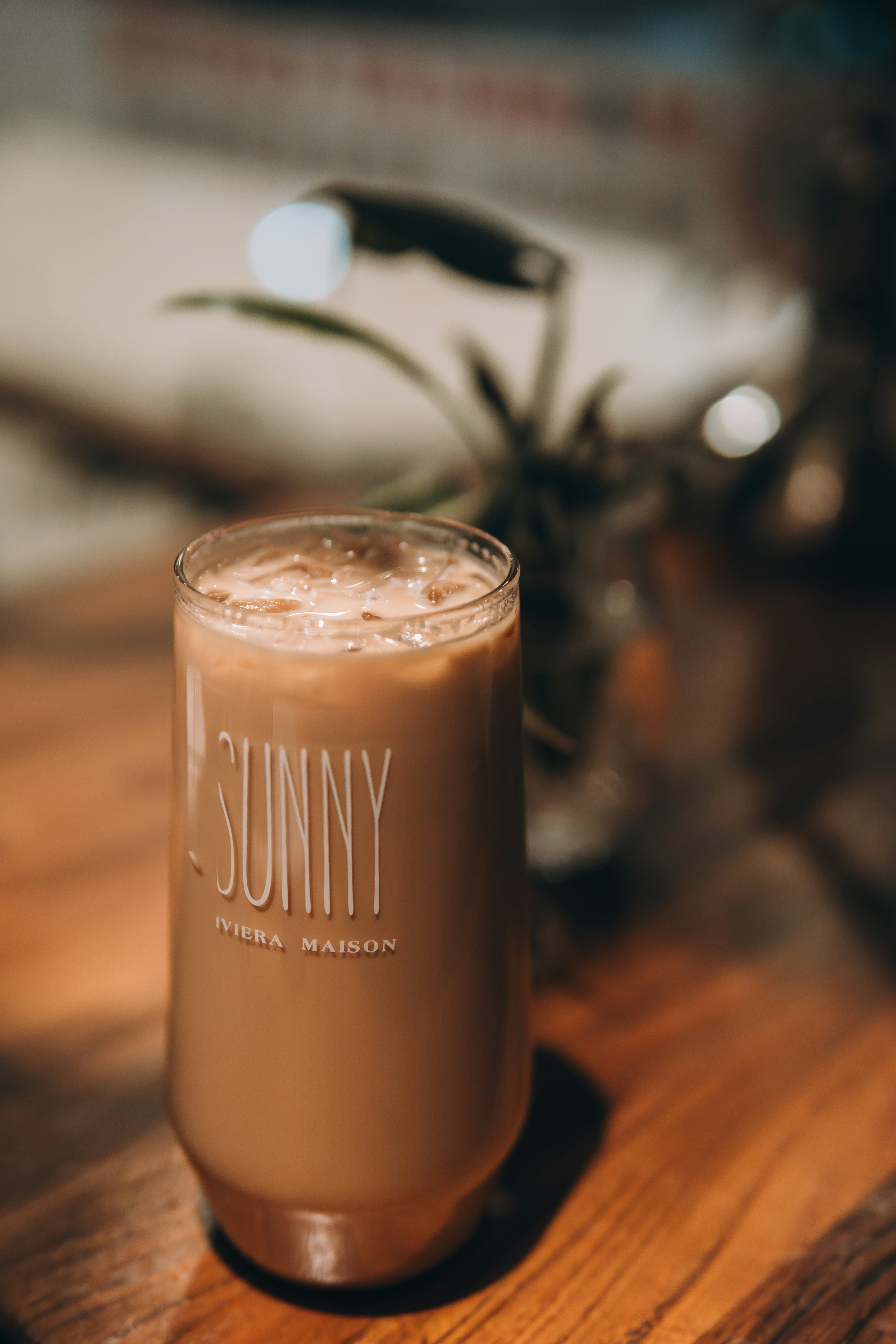 a drink sitting on top of a wooden table