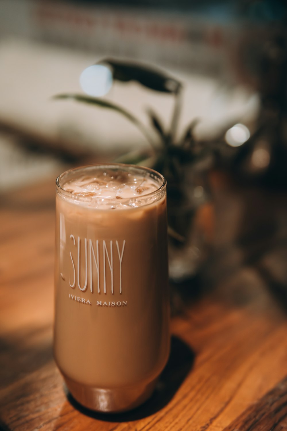 a drink sitting on top of a wooden table