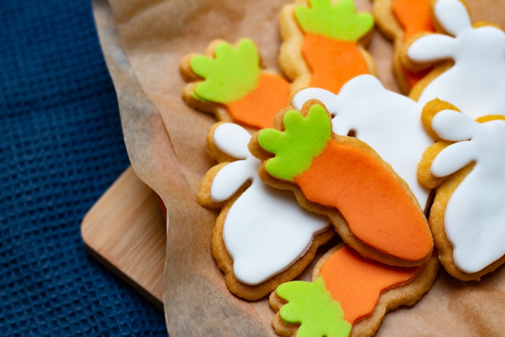 a bunch of decorated cookies sitting on top of a piece of paper