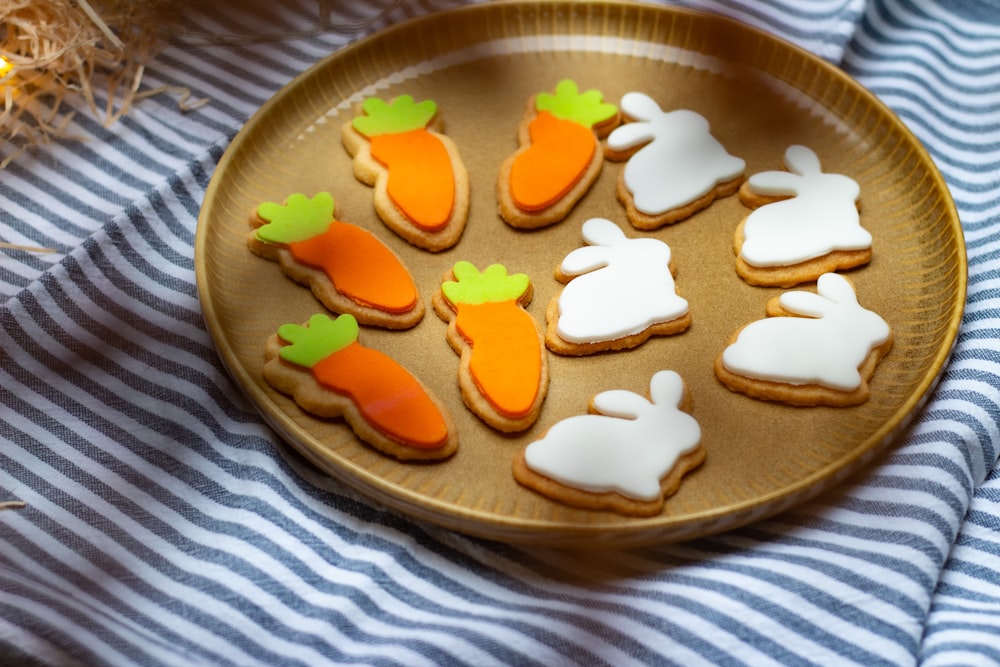 a plate of decorated cookies on a table