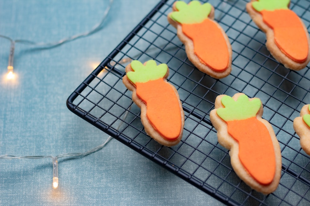 a cooling rack with carrot cookies on it