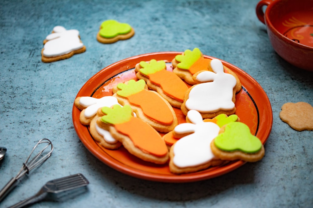 a plate of decorated cookies on a table