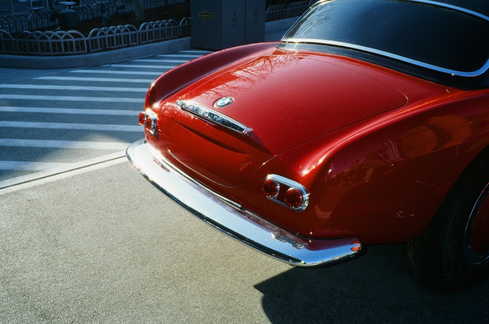 a red car parked on the side of the road