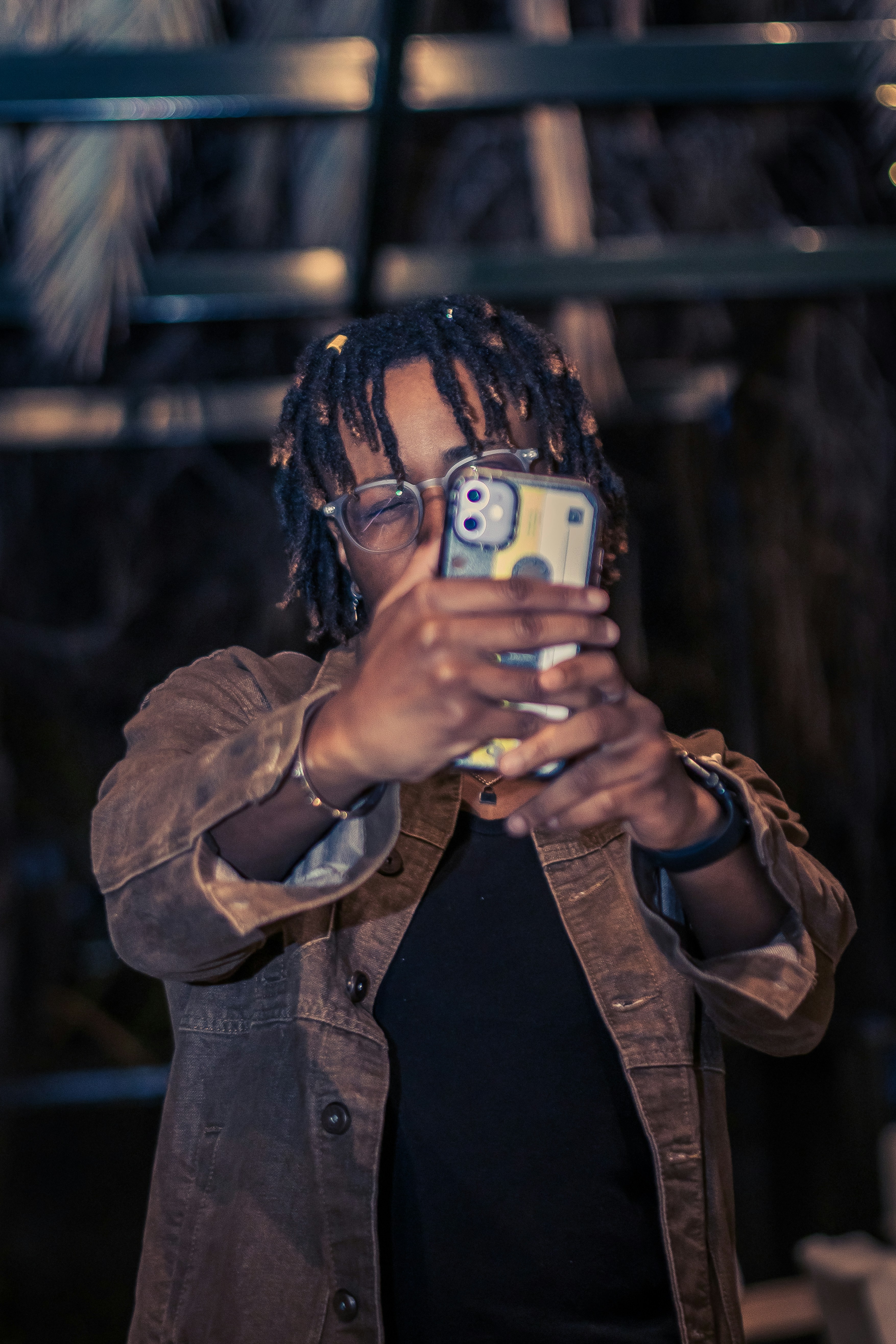 a person taking a picture with a cell phone