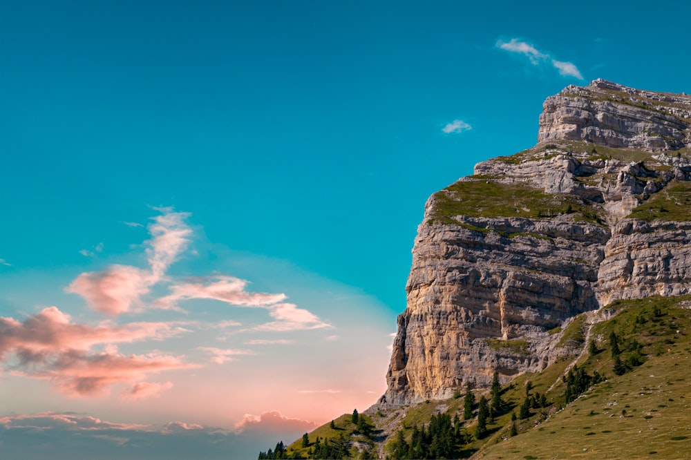 a very tall mountain with a very pretty sky in the background