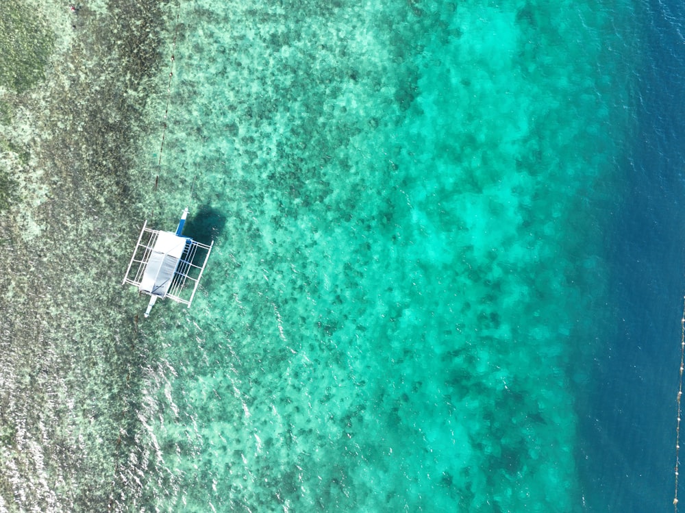 an aerial view of a boat in the water