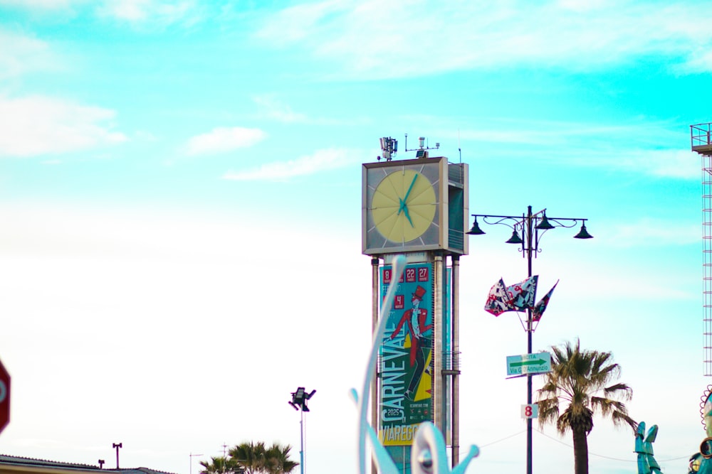 a tall clock tower sitting on the side of a road