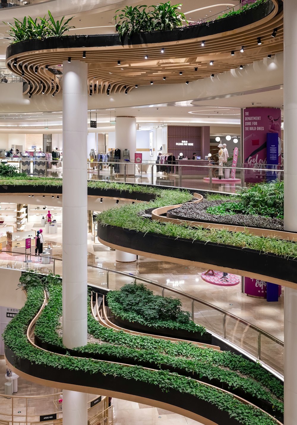 a mall filled with lots of green plants