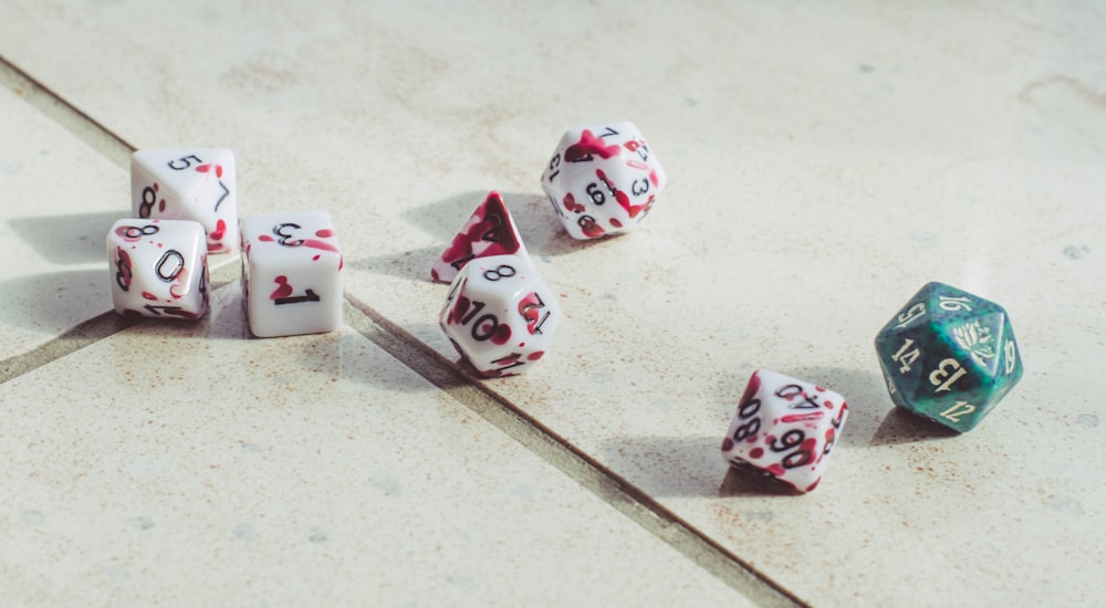 a group of dice laying on top of a floor