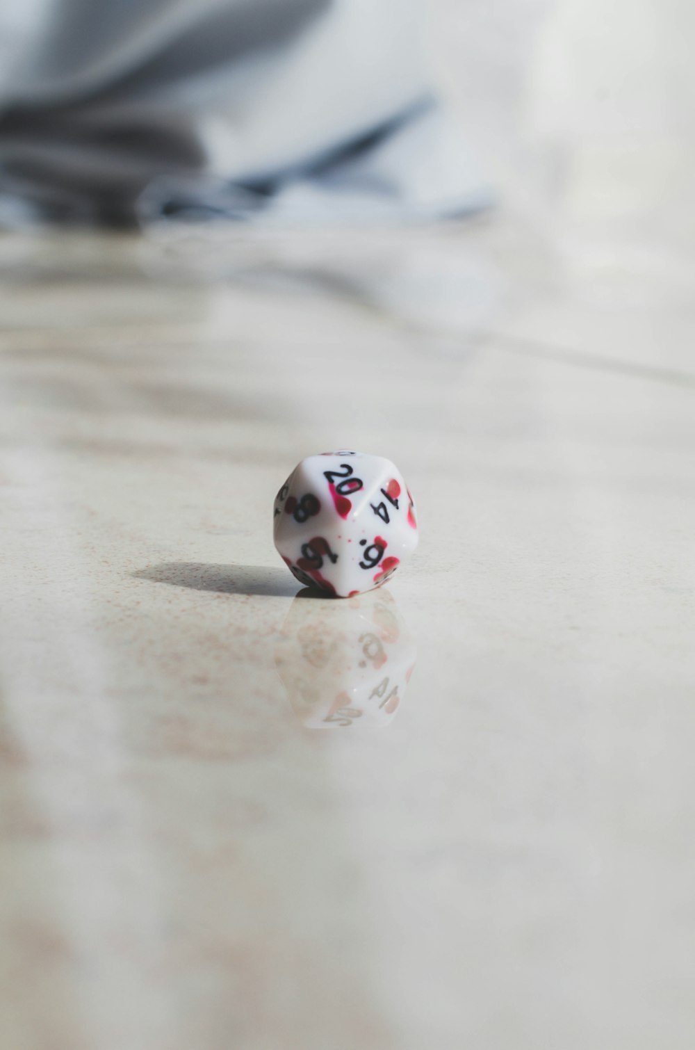 a close up of a dice on a table
