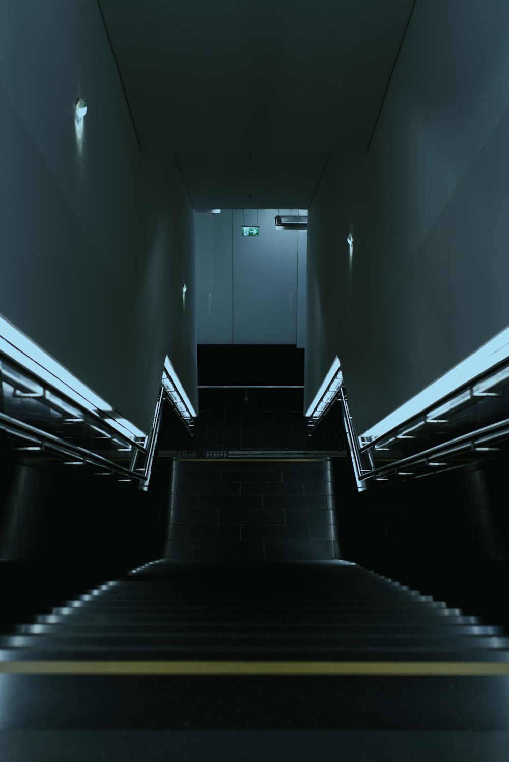a set of stairs leading up to an elevator