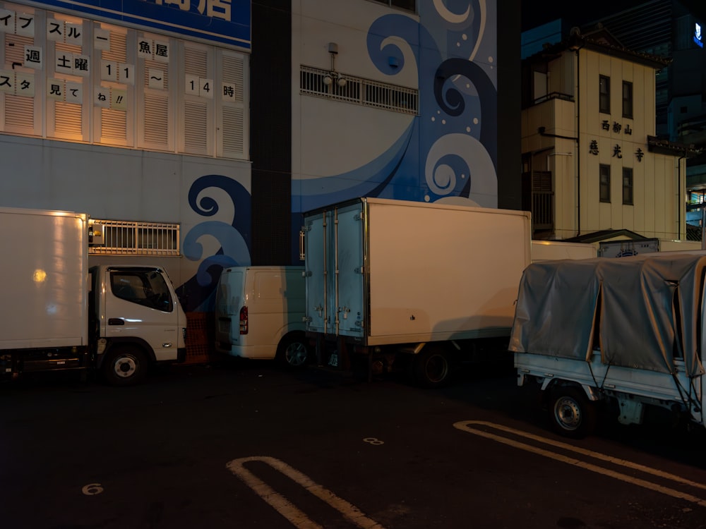 a couple of trucks parked in front of a building