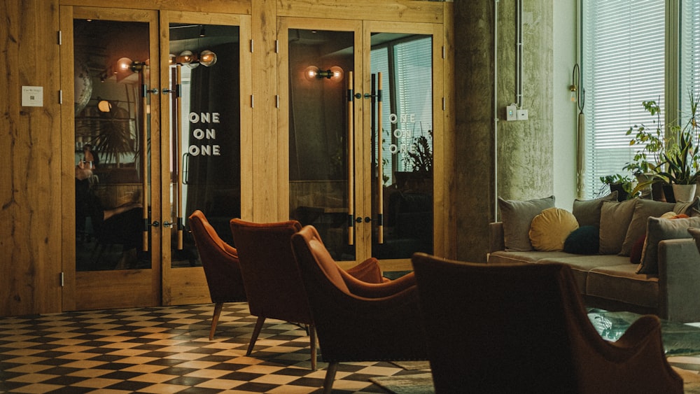 a living room filled with furniture and a checkered floor