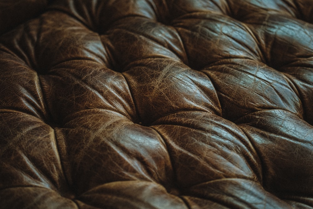 a close up of a brown leather upholster