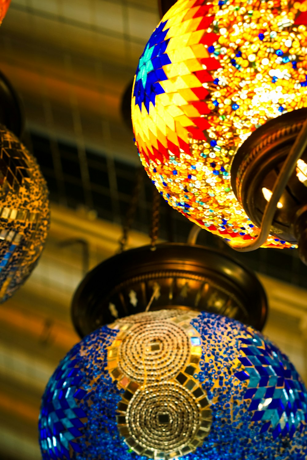 a bunch of colorful lights hanging from a ceiling