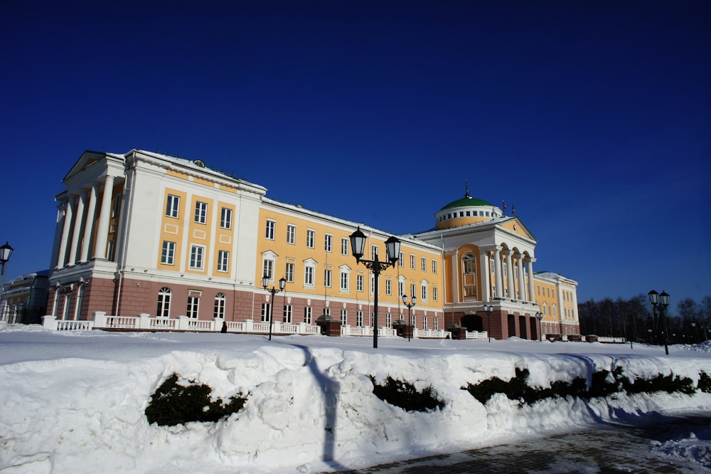 a large building with a lot of snow on the ground