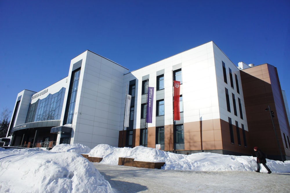 a building with a lot of snow in front of it