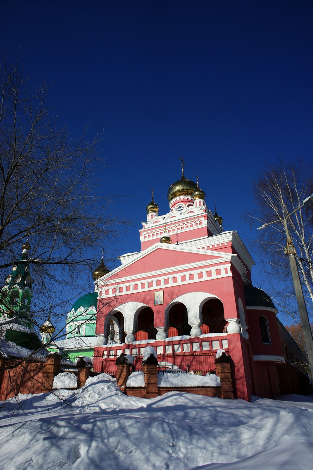 a red and white building surrounded by snow