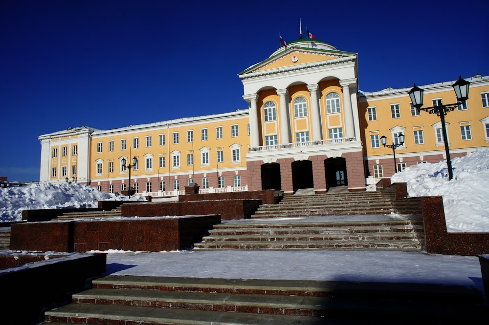 a large building with a lot of snow on the ground