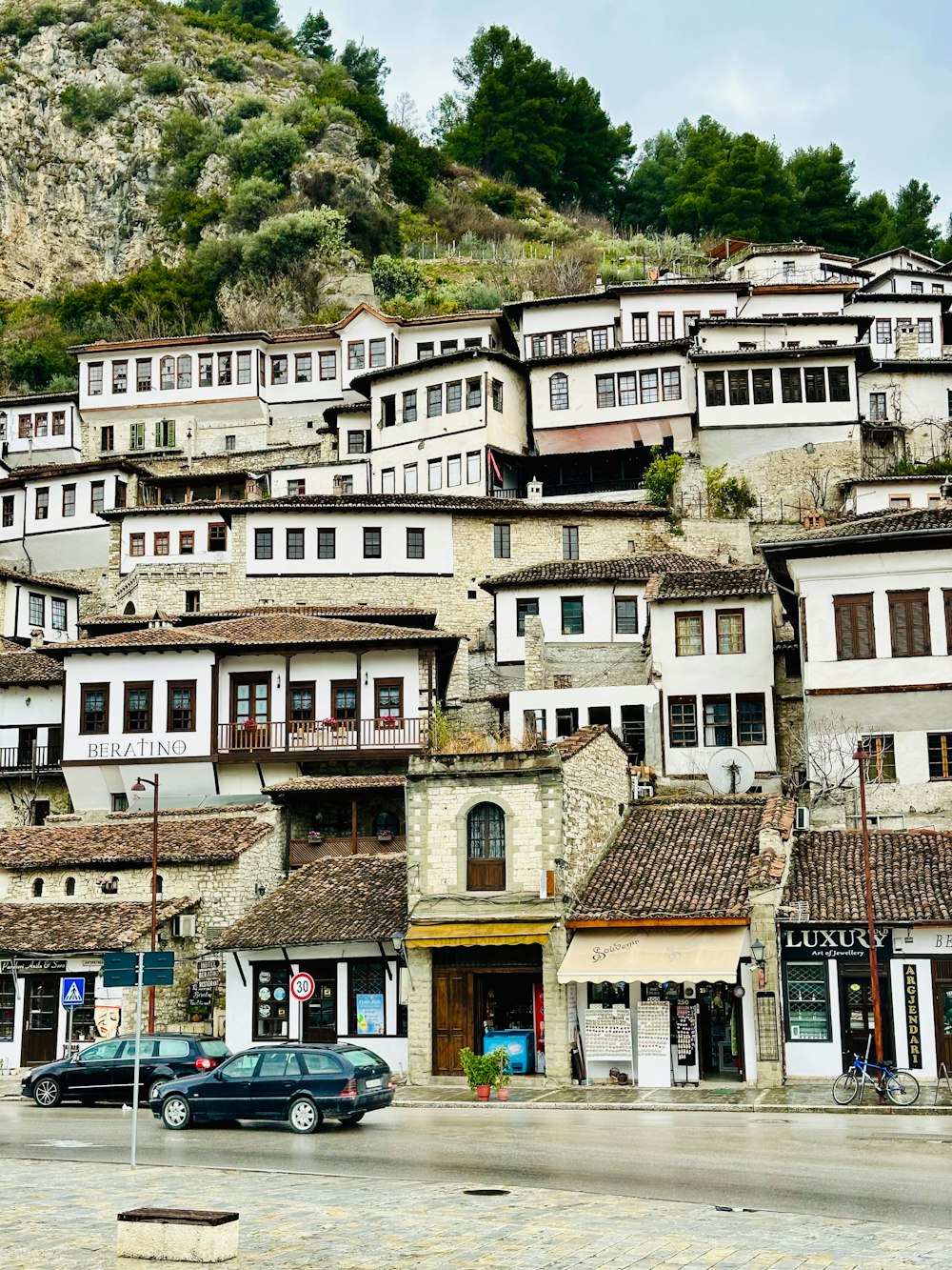 a bunch of buildings that are on the side of a hill