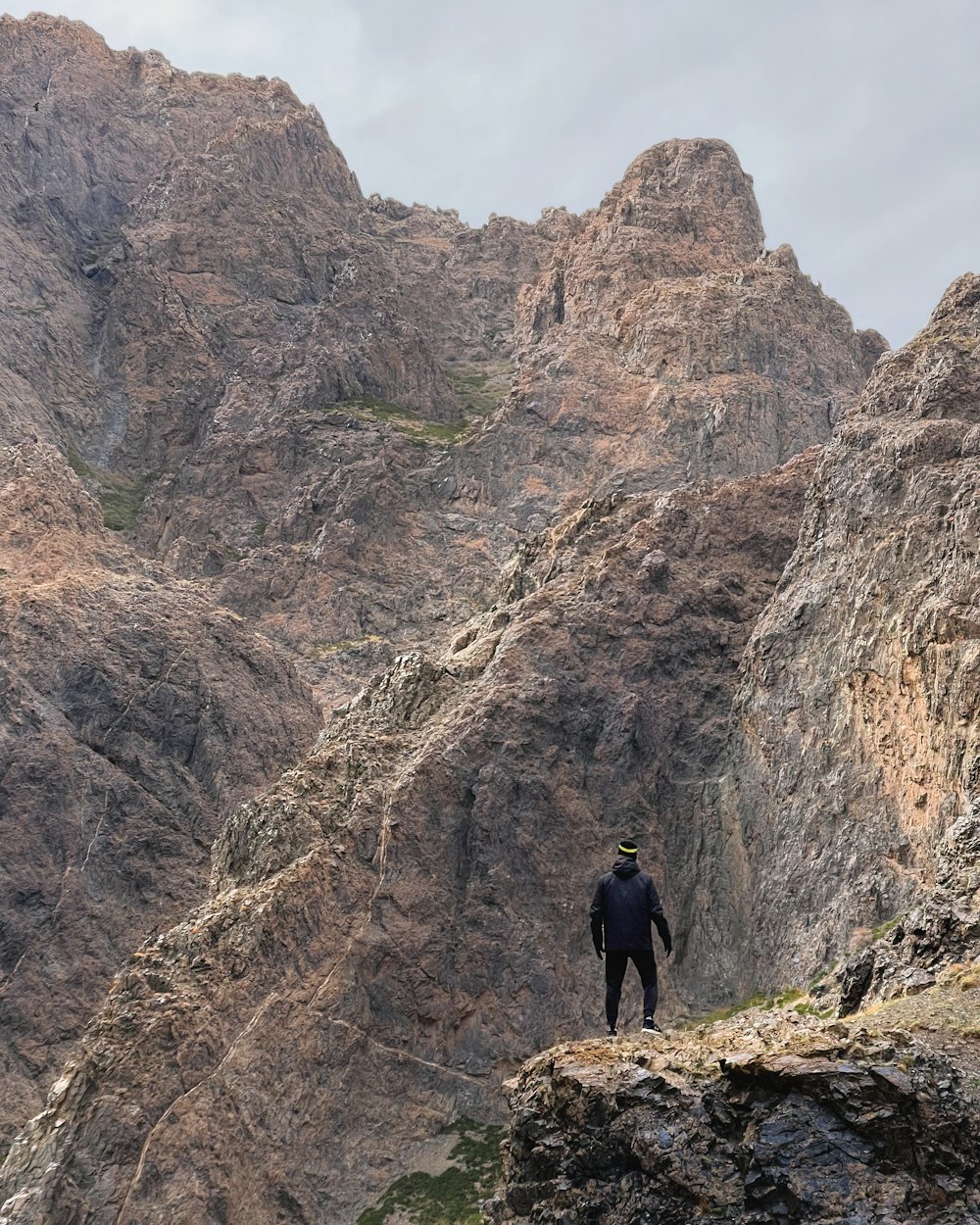 a man standing on top of a rocky mountain