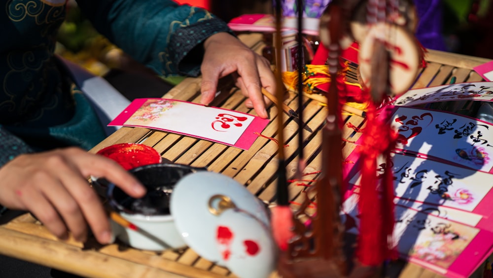 a person using a computer mouse on a bamboo table