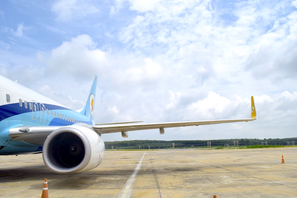 a large jetliner sitting on top of an airport tarmac