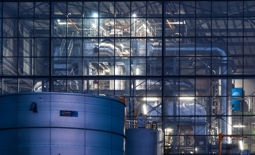 a large building with a lot of pipes in front of it