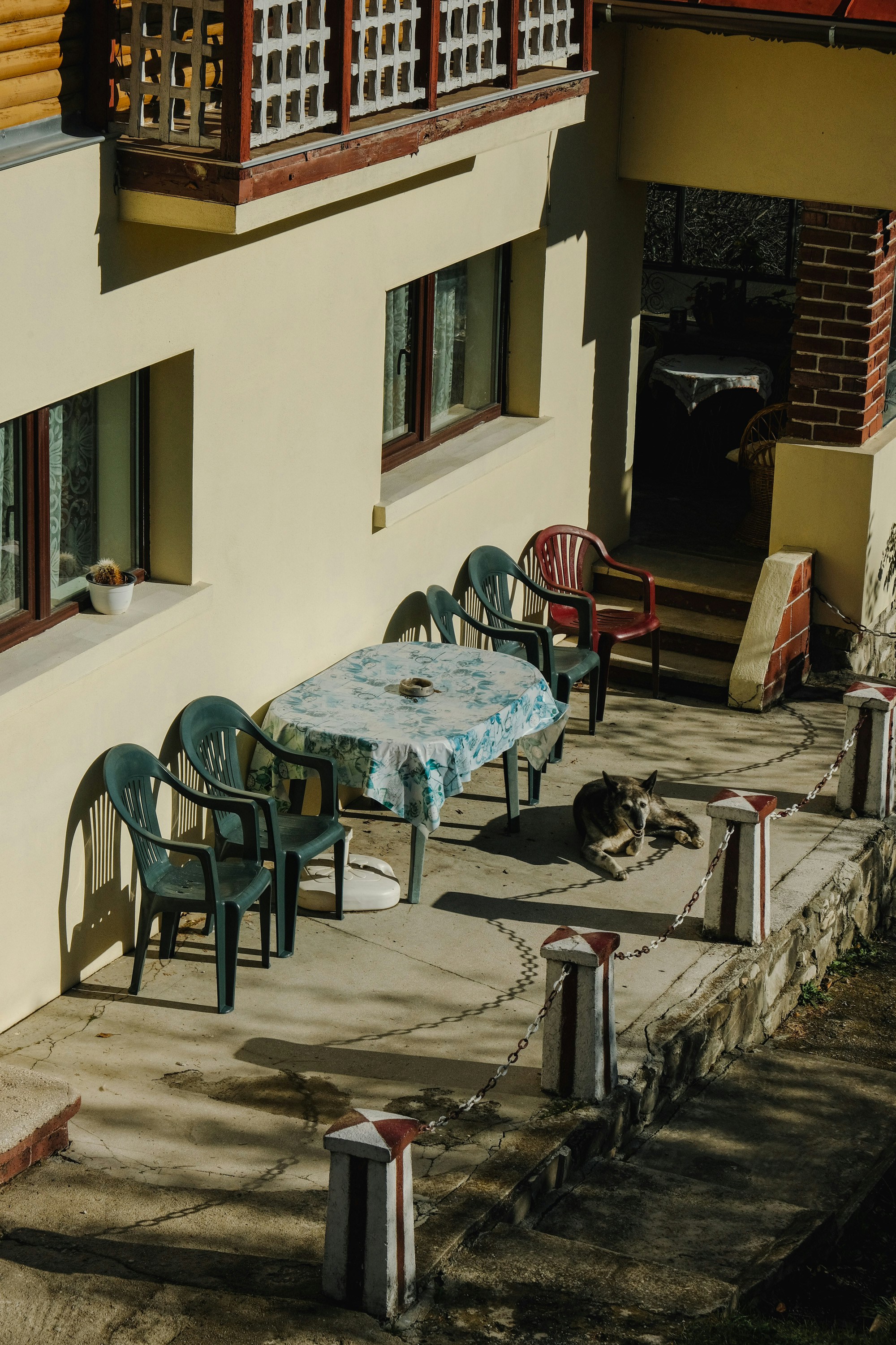 a table and chairs outside of a building