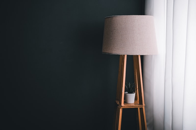 Floor lamp with shelves in cosy living room