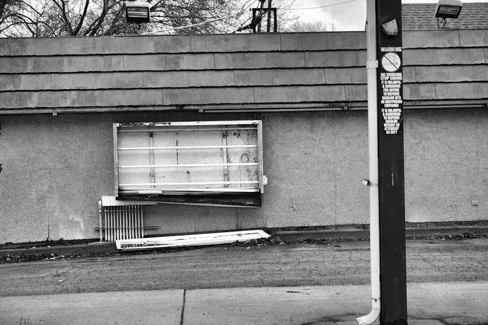 a black and white photo of a window on a building