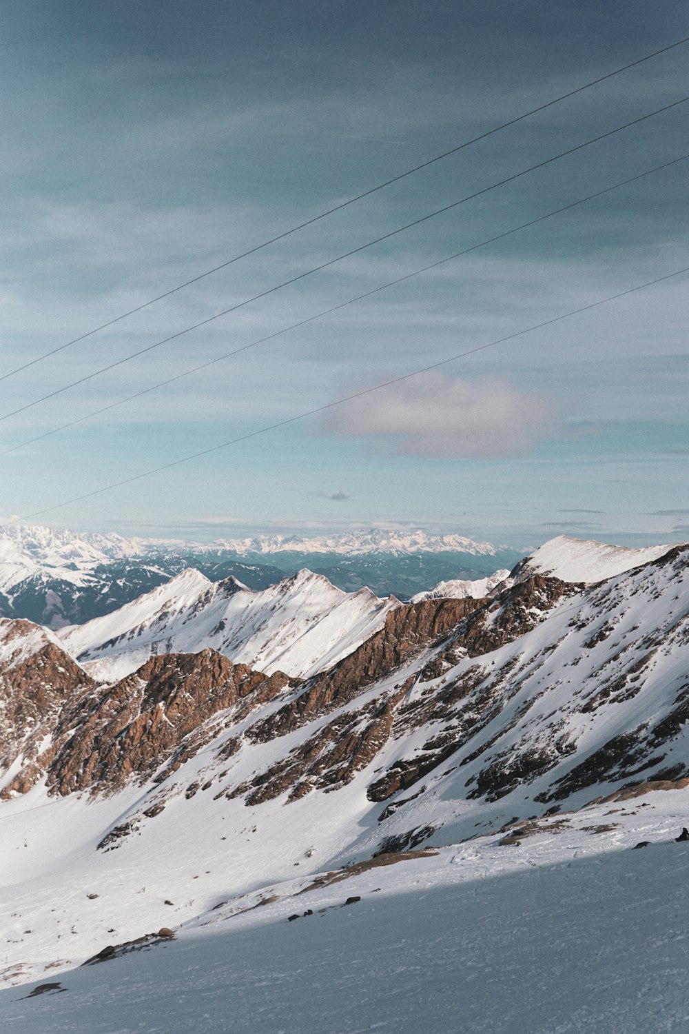 a man riding skis on top of a snow covered slope