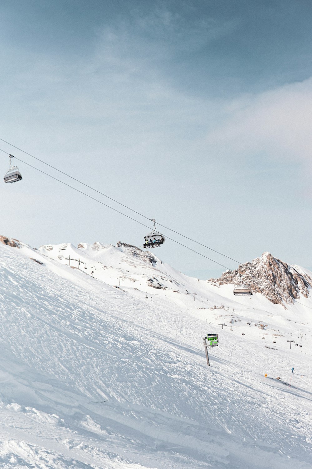 a man riding skis down a snow covered slope