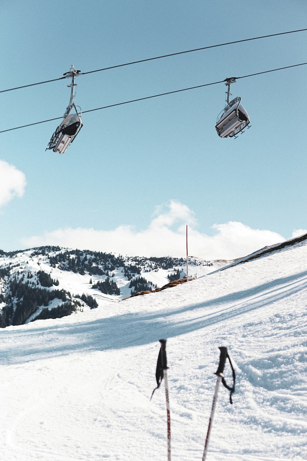 a person riding skis down a snow covered slope