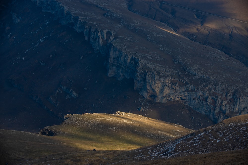 a view of a mountain with a few snow on it