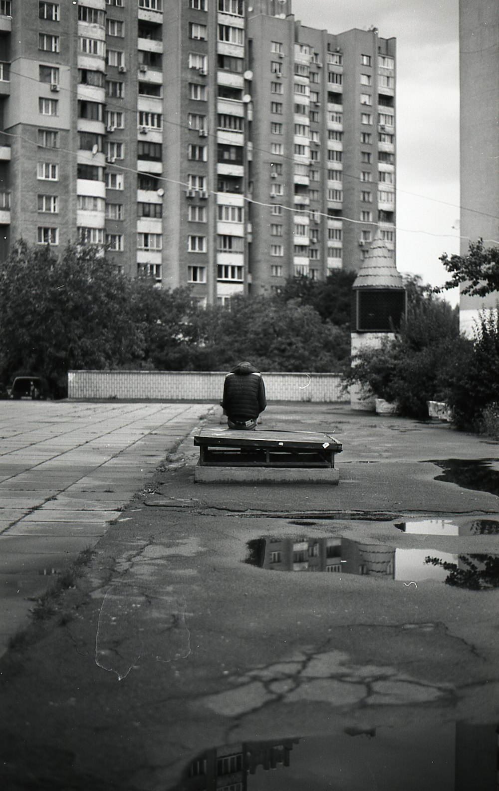 a black and white photo of a park bench