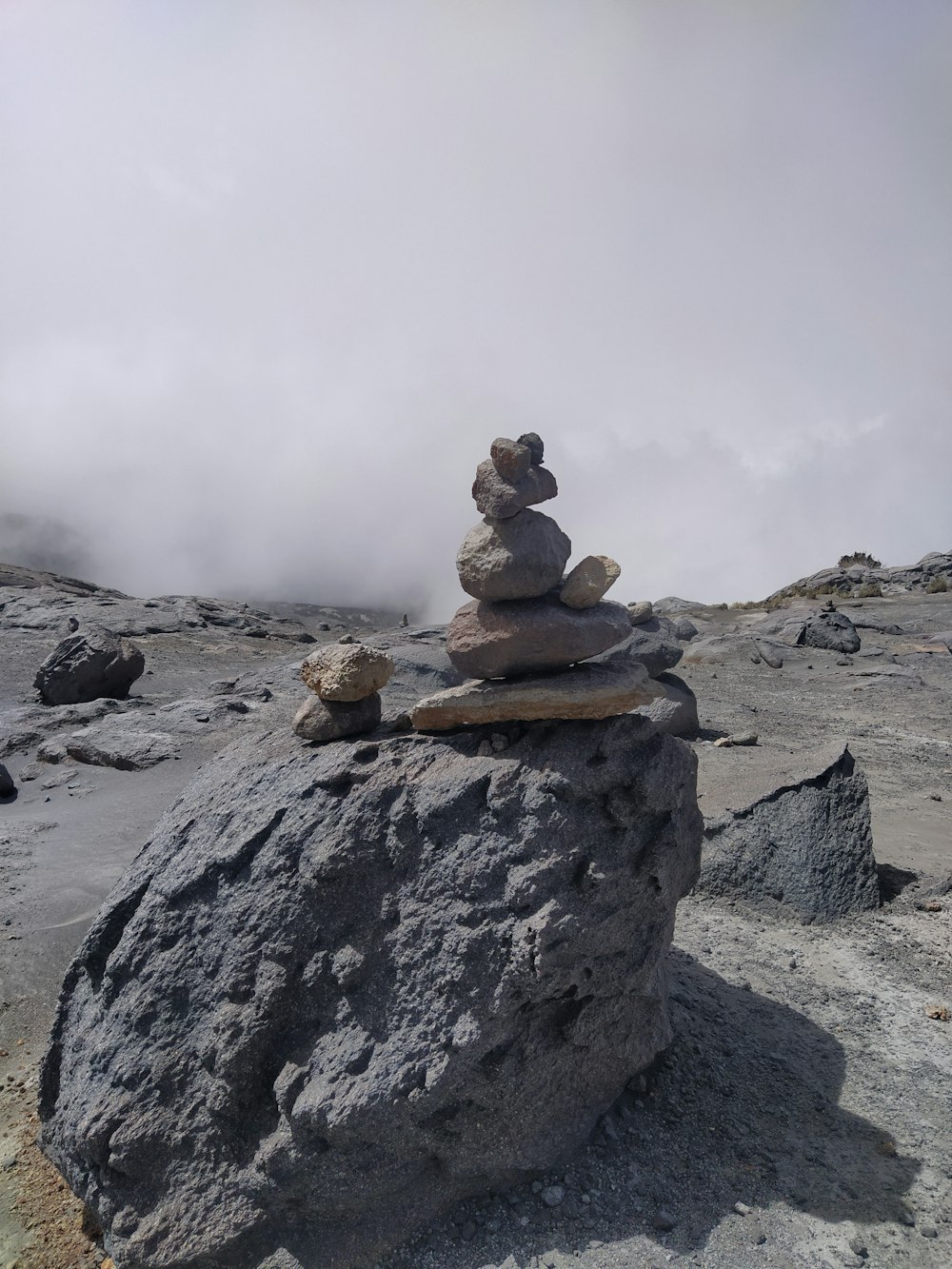 a pile of rocks sitting on top of a mountain