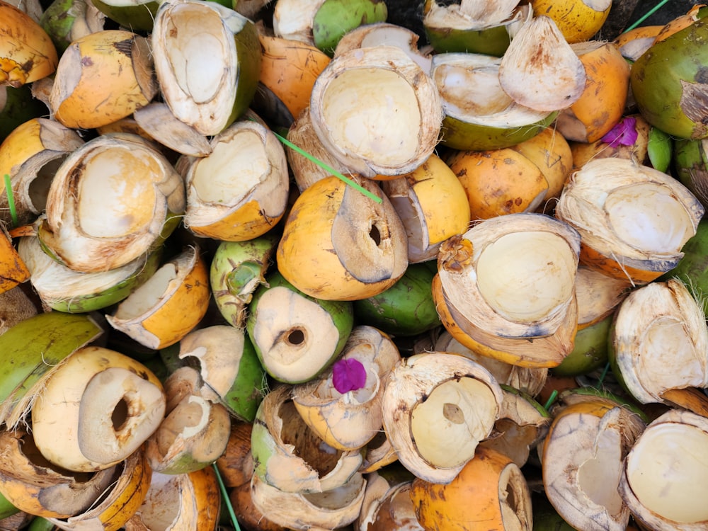 a pile of coconuts that have been cut open