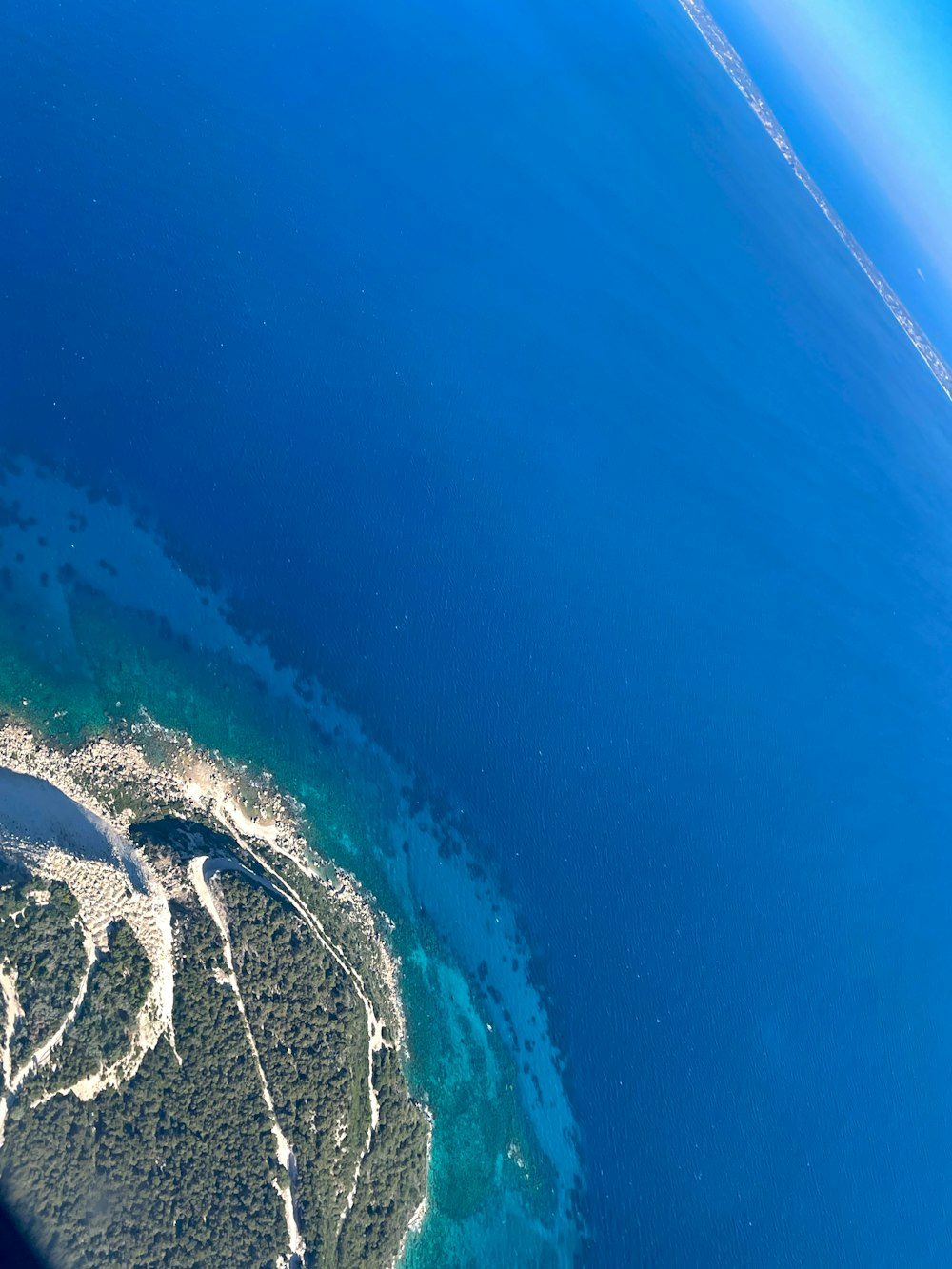 an aerial view of an island in the ocean